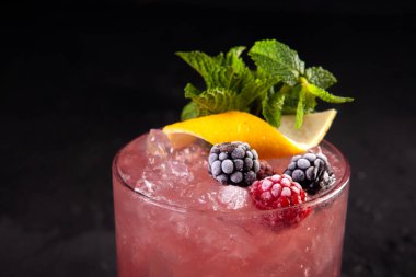 beautifully decorated alcoholic cocktail in studio on black background