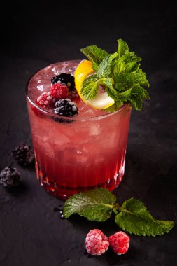 beautifully decorated alcoholic cocktail in studio on black background