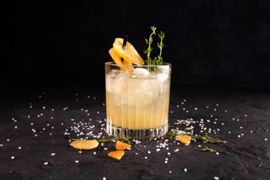 beautifully decorated alcoholic cocktail in studio on black background