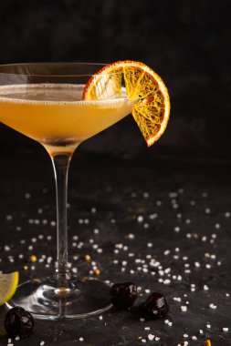 beautifully decorated alcoholic cocktail in studio on black background