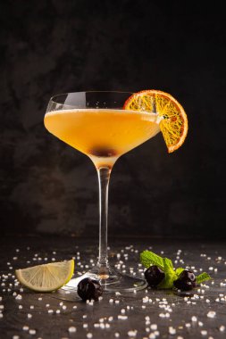 beautifully decorated alcoholic cocktail in studio on black background