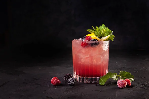 beautifully decorated alcoholic cocktail in studio on black background