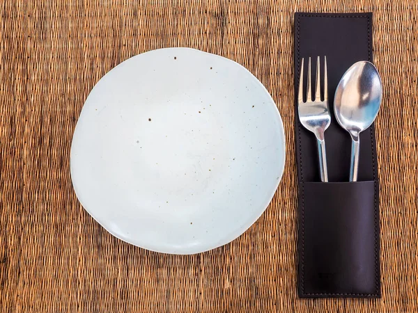 Ceramic Plate Empty White Freeform Shaped Porcelain Dish Stainless Spoon — Stock Photo, Image