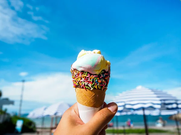 Ice Cream Hand Beach Blue Sky Background Rainbow Color Ice — Stock Photo, Image