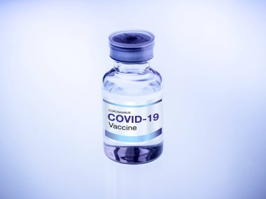 Covid-19 aşısı. Modern etiket Covid-19 aşısı şişe şişesinde. Araştırma laboratuarındaki ışık masasında, mavi tonda. Bir koronavirüs aşısı geliştirilmesi ve oluşturulması.
