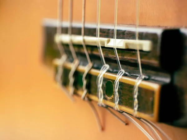 Closeup Acoustic Guitar Background Close Six Strings Saddle Bridge Brown — Foto de Stock