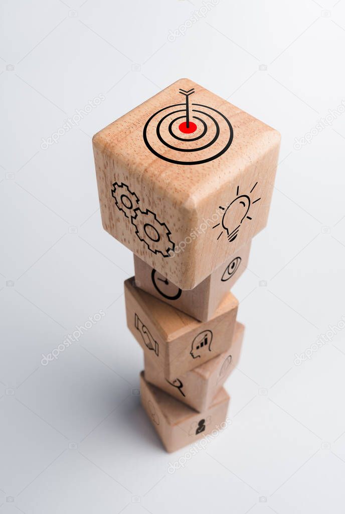 Business strategy with growth success process for for Leadership and teamwork concept. The action plan, business target icon on wooden cube blocks stack on white background, vertical style.