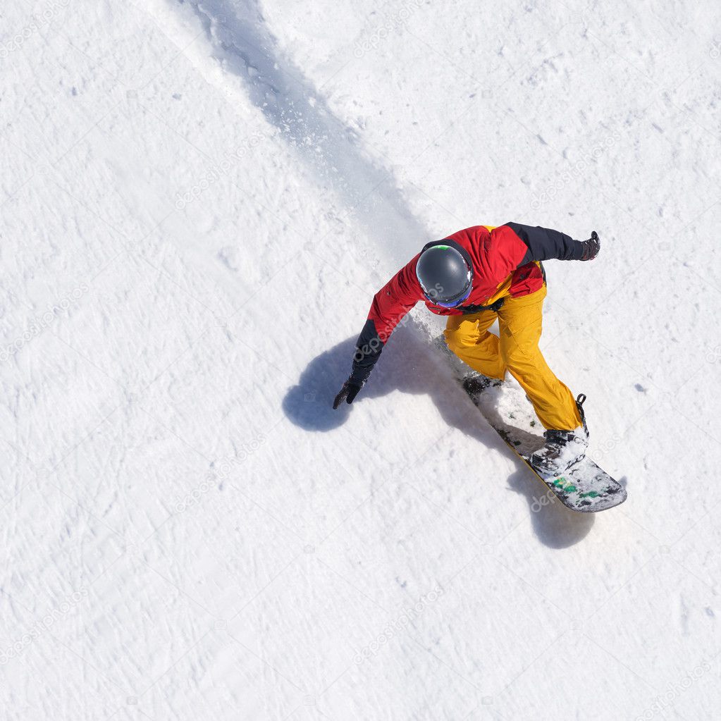 Snowboarder riding on loose snow Freeride