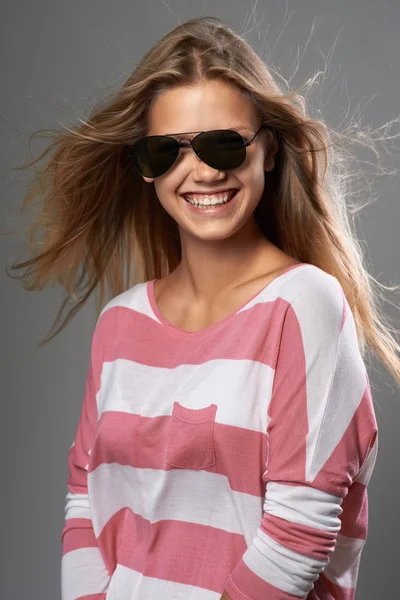 Woman laughing with off sunglasses — Stock Photo, Image