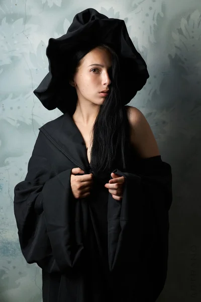 Girl in a witch costume sexy looks — Stock Photo, Image