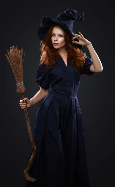 Beautiful red-haired girl in a  costume witch — Stock Photo, Image