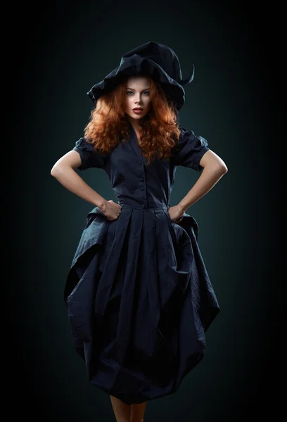 Beautiful red-haired girl in a  costume witch — Stock Photo, Image