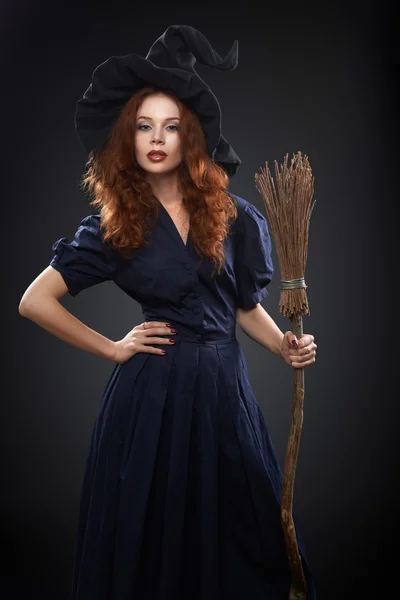 Beautiful red-haired girl in a  costume witch — Stock Photo, Image