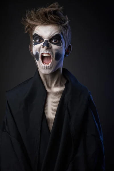 Teenager with makeup skull cape — Stock Photo, Image