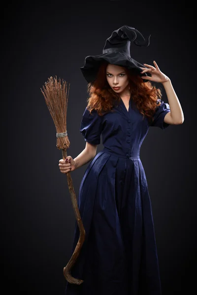 Beautiful red-haired girl in a  costume witch — Stock Photo, Image