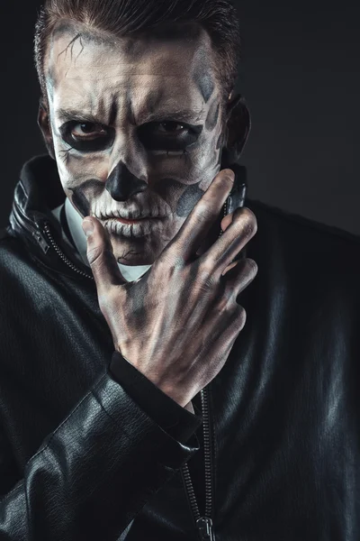 Portrait of pensive man with make-up  skull — Stock Photo, Image