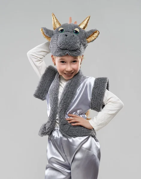 Girl in a cow costume shows the horns — Stock Photo, Image