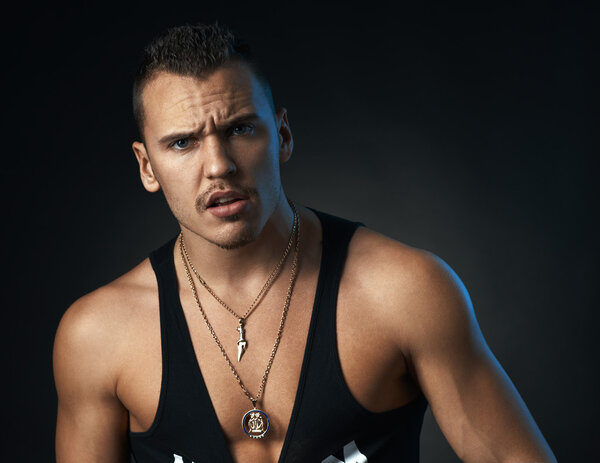 disgruntled man on  black background