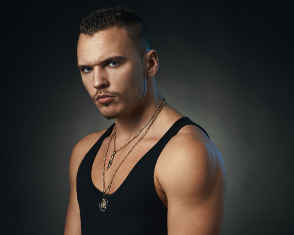 serious sports man on  black background