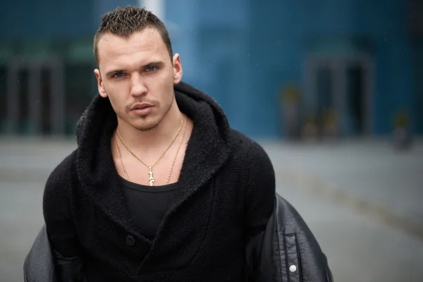 Portrait of a confident man in   black sweater — Stock Photo, Image