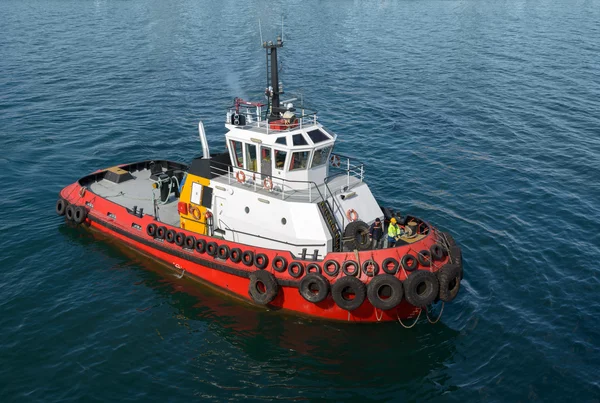 Red tug boat on  water — Stock Photo, Image