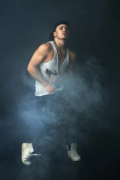 Stylish man dancing in  mist — Stock Photo, Image