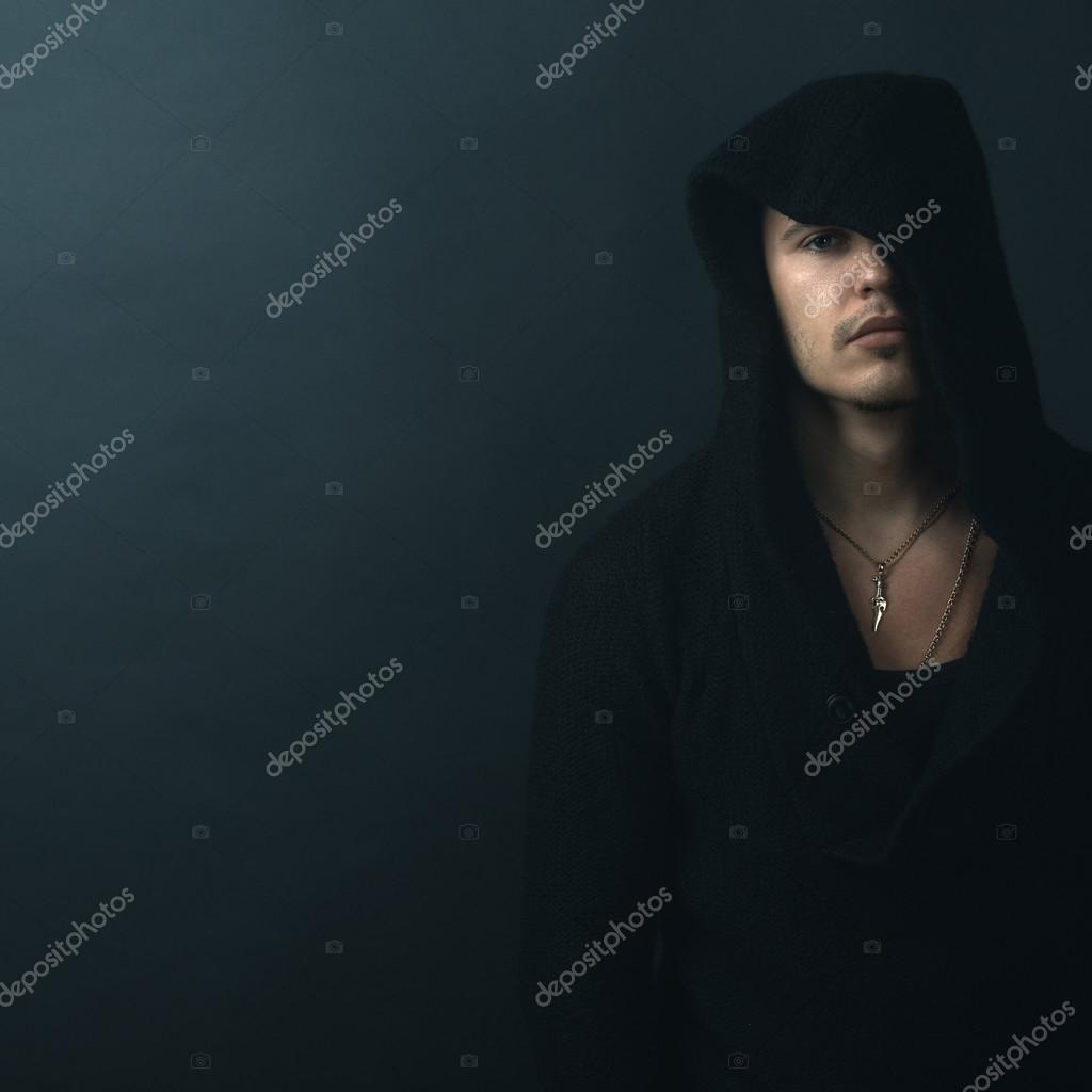 man in a black hoodie