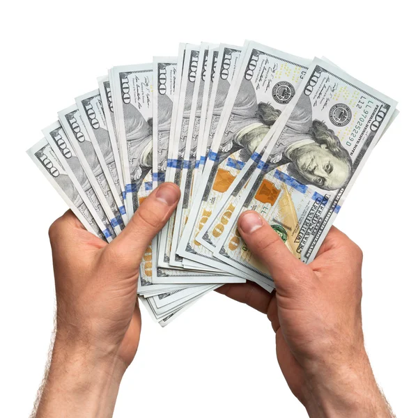 Mãos segurando um punhado de dinheiro — Fotografia de Stock