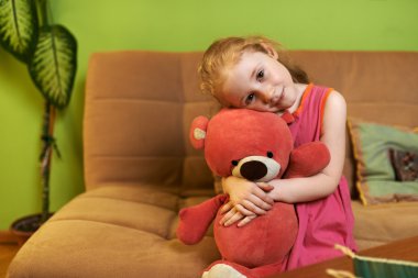 beautiful girl loves  teddy bear