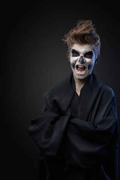 Angry teenager with makeup skull cape — Stock Photo, Image