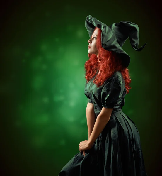 Beautiful red-haired girl in  costumes witch — Stock Photo, Image