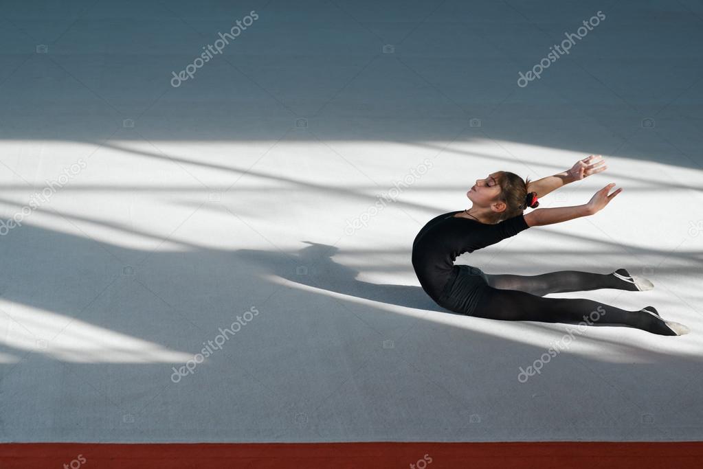 Girl do backfold rhythmic gymnastics