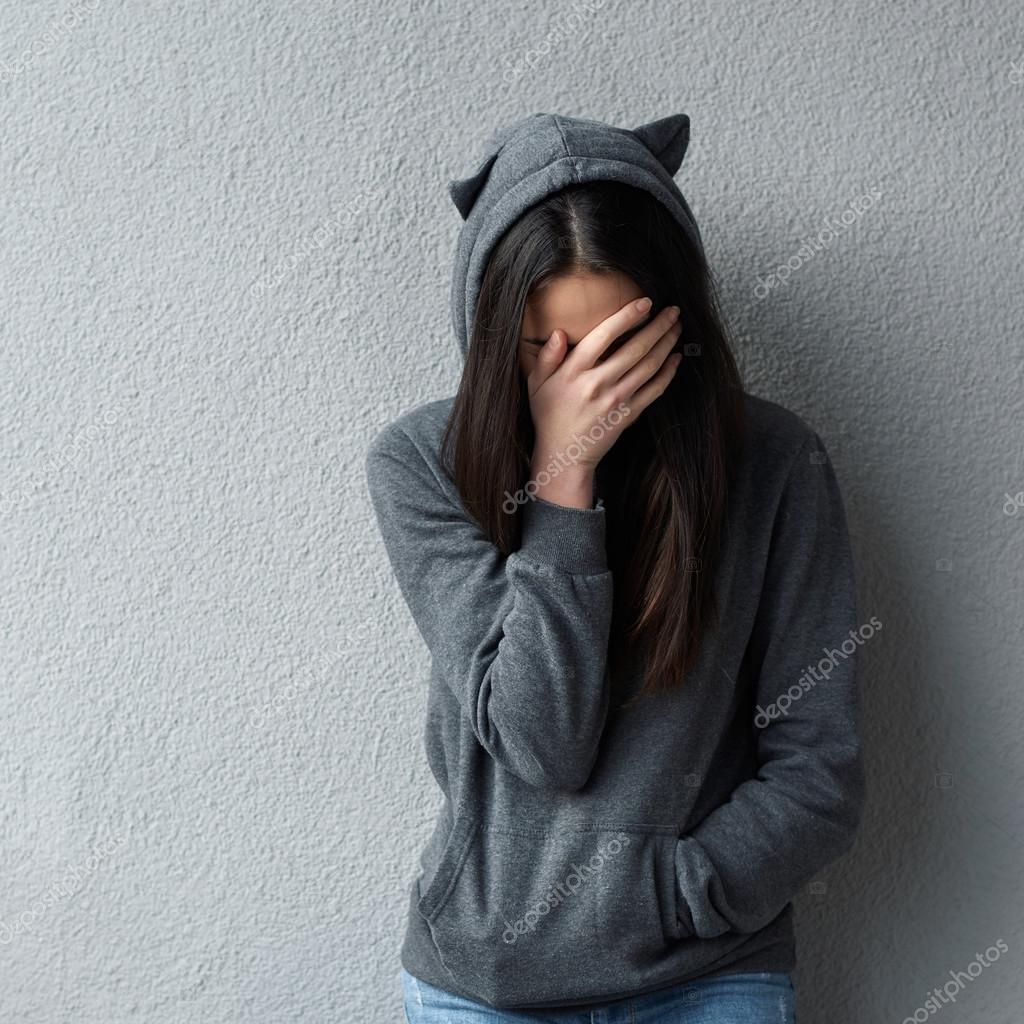 girl hiding in hoodie