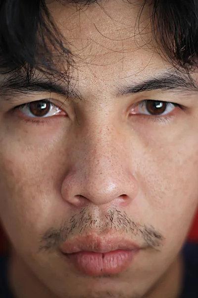 Ázsiai fiatalember arca — Stock Fotó