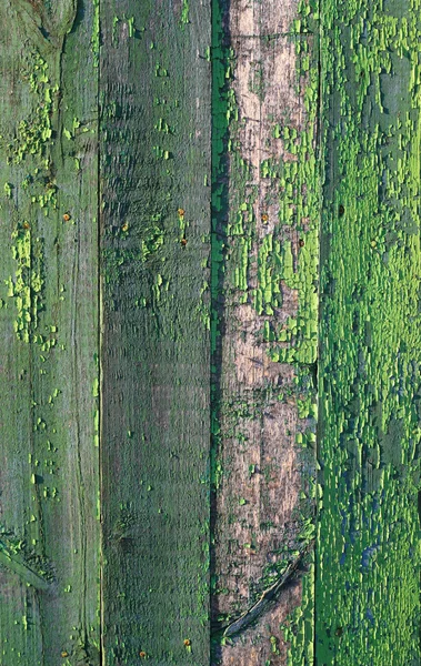 Flaking green paint on old wooden fence — Stock Photo, Image