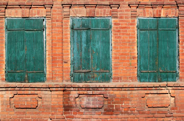 Background image of three old green bolted shuttered wooden wind — Stock Photo, Image