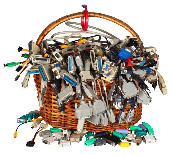 Basket with many different computer cables wires connectors sockets and plugs. — Stock Photo, Image
