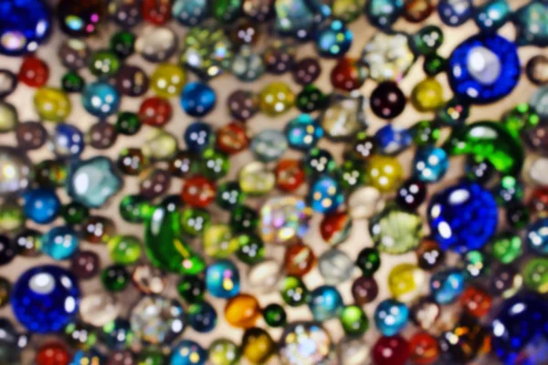 Blurred background of colorful glass marbles — Stock Photo, Image