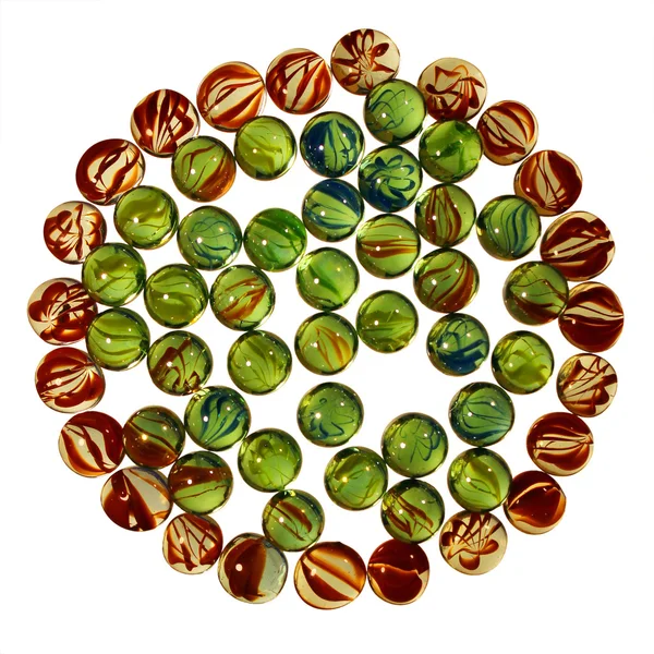 Circle pattern of colorful transparent glass marbles isolated on — Stock Photo, Image