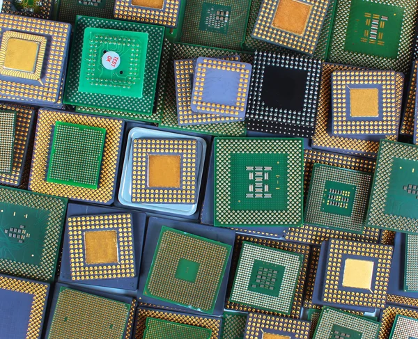 Many old CPU chips and obsolete computer processors as background — Stock Photo, Image