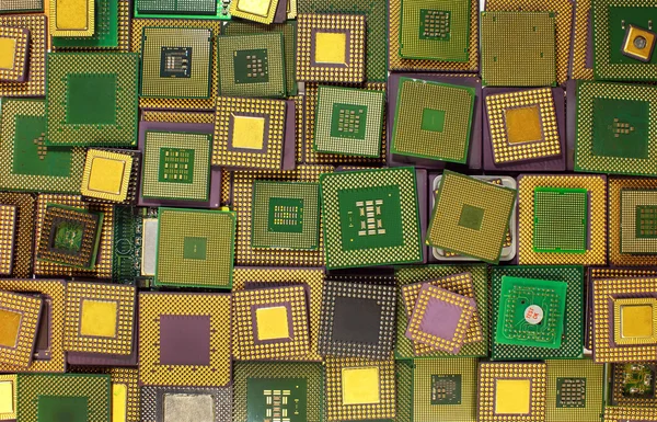 Many old CPU chips and obsolete computer processors as background — Stock Photo, Image