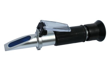 Portable refractometer, used for the identification of substances and concentration measurement of fluids.  clipart