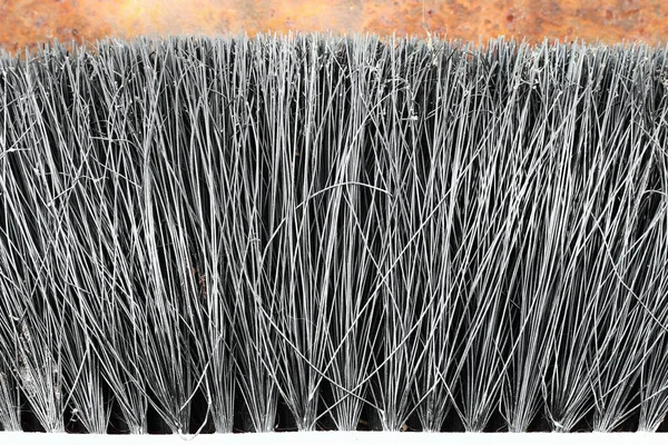 Plastic black broom bristles closeup texture