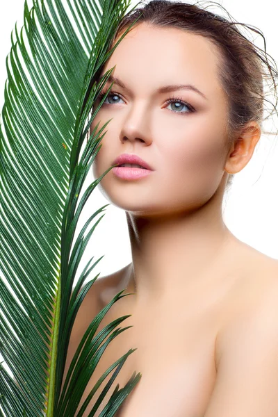 Woman with palm leaf. — Stock Photo, Image