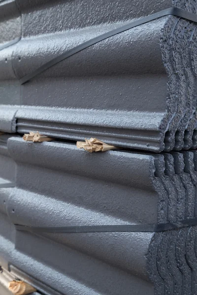 Stack of concrete roof tile (gray color) at construction site — Stock Photo, Image