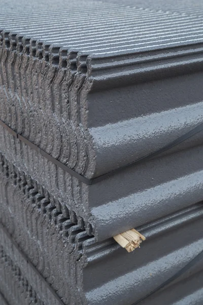 stack of concrete roof tile (gray color) at construction site