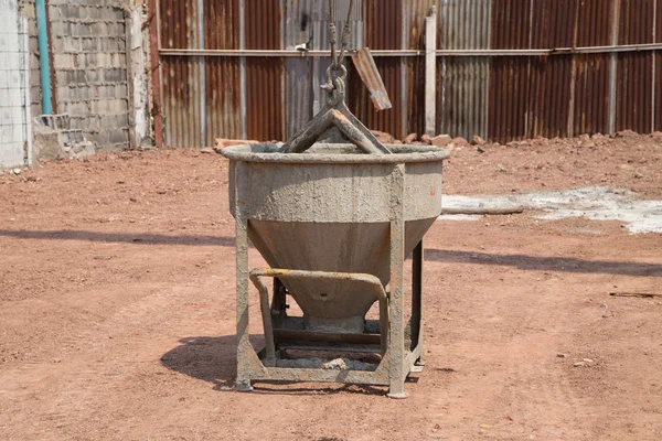 Crane lifting concrete mixer container — Stock Photo, Image