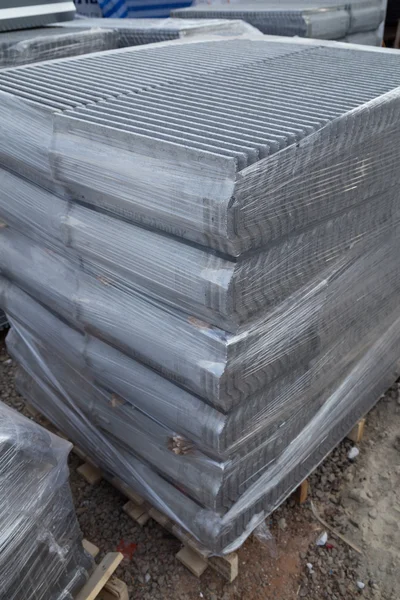 Stack of concrete roof tile (gray color) at construction site — Stock Photo, Image