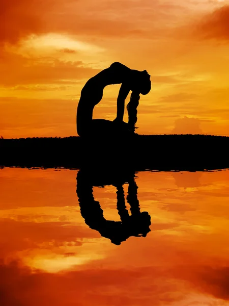 Silhouette of a beautiful Yoga woman — Stock Photo, Image