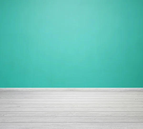 Інтер'єр кімнати з зеленою бетонною стіною і білою дерев'яною підлогою — стокове фото